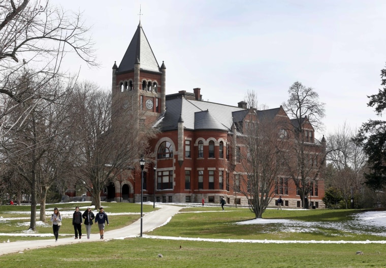 Students walk past historic Thompson Hall at the University of New Hampshire in Durham in 2016.