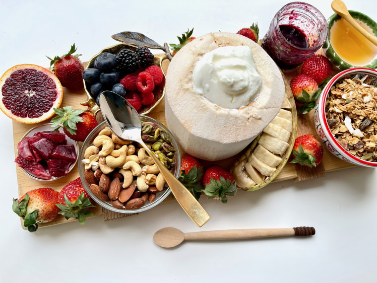 For a healthier take on a breakfast board, set out all the fixings for a granola bowl.