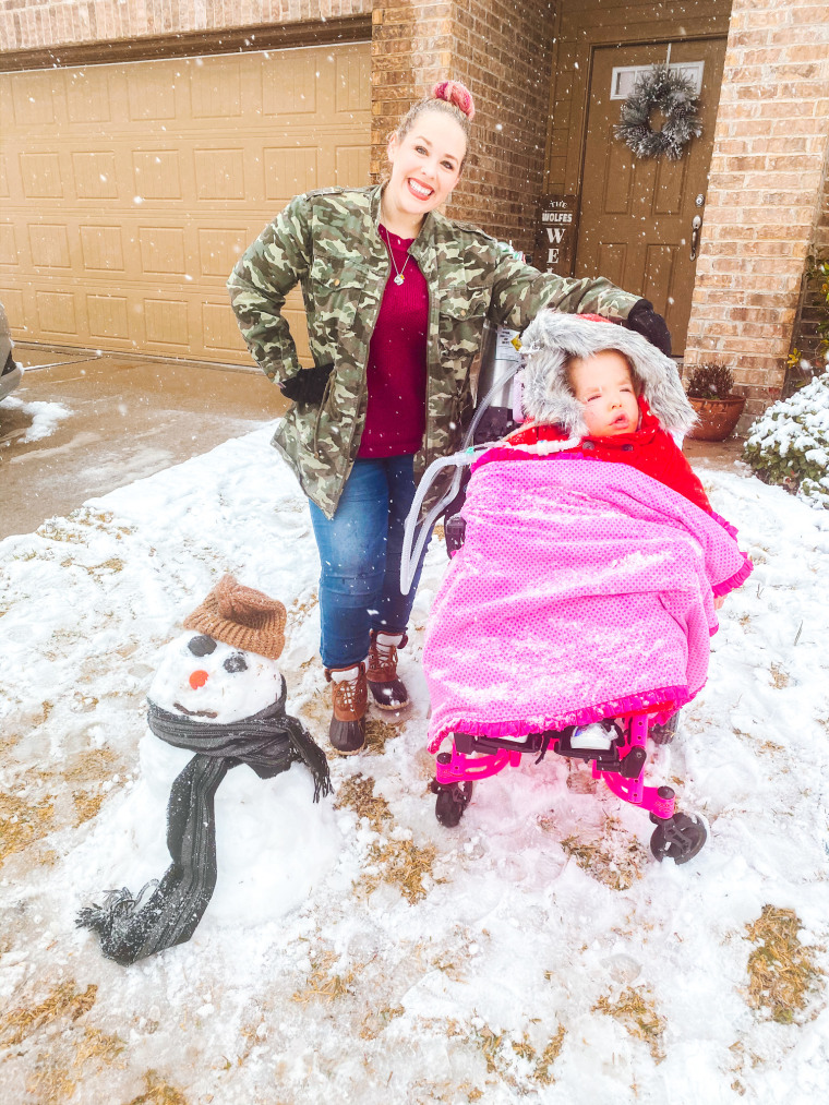 Stephanie Wolf and her daughter, who uses a ventilator and oxygen. 