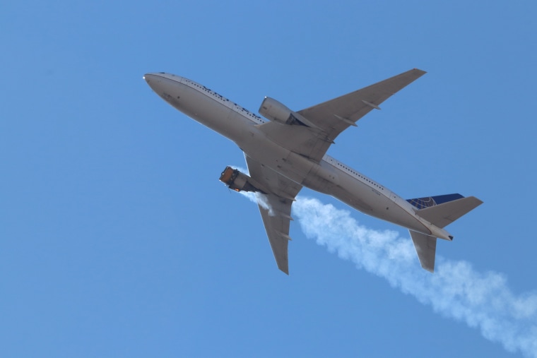 United Airlines flight UA328 returns to Denver International Airport with its starboard engine on fire after it called a Mayday alert, over Denver, Colo., on Feb. 20, 2021.