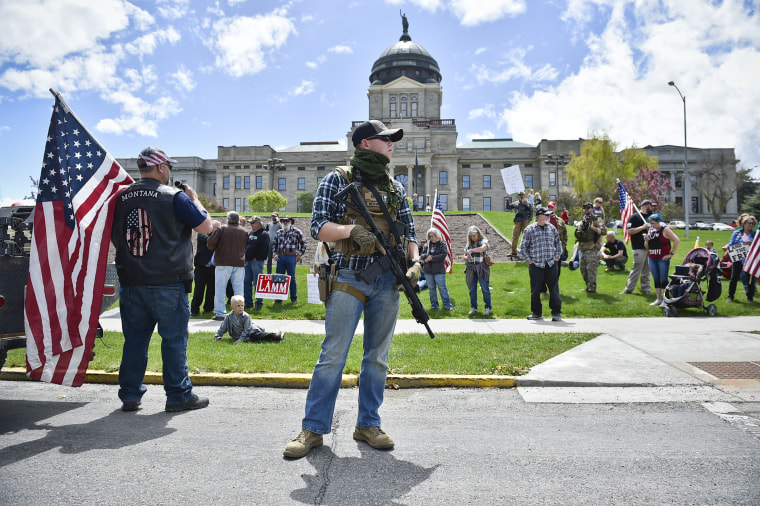 Protesters gather outside the Montana State Capitol in Helena, Mont., on May 20, 2020 criticizing Gov. Steve Bullock's response to the Covid-19 pandemic.