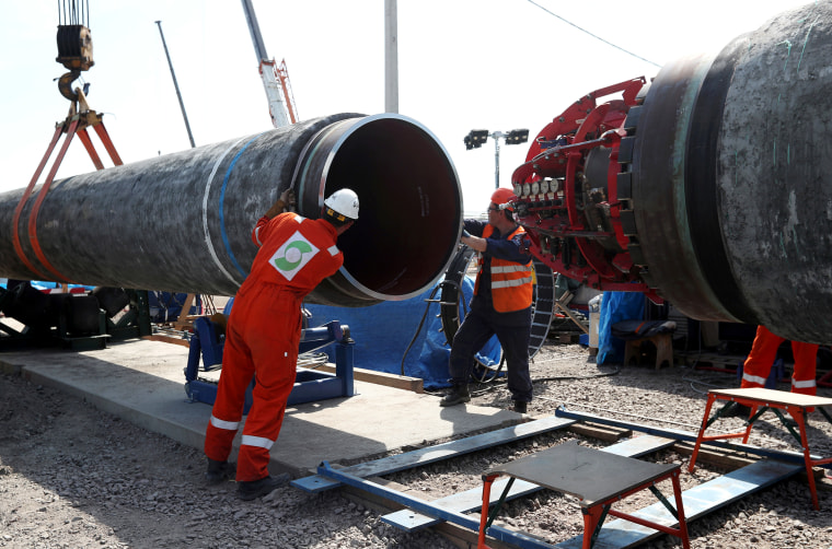 Image: Workers are seen at the construction site of the Nord Stream 2 gas pipeline in Russia.