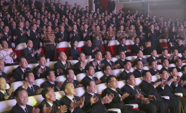 Image: North Korean leader Kim Jong Un, center, and his wife Ri Sol Ju watch a performance, marking the birth anniversary of former leader Kim Jong Il, in Pyongyang, North Korea