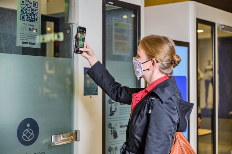 Image: A customer scans a QR code to reserve a ZenSpace pod.