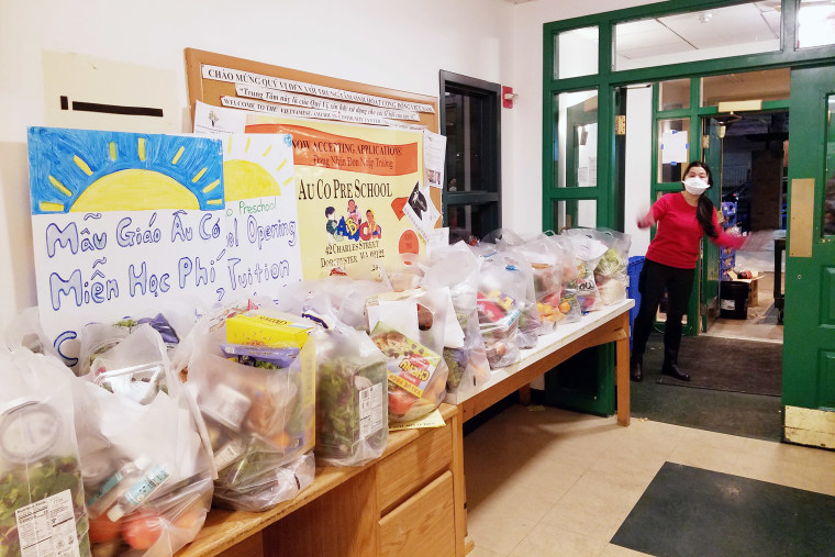 Image: VietAid, a Boston nonprofit, distributes free groceries and meals to the Vietnamese community.