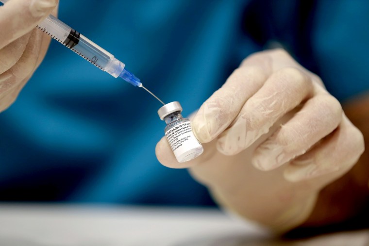 Image: LA medic prepares a dose of the COVID-19 Pfizer/BioNTech vaccine at Lebanon's American University Medical Center in the capital Beirut, Lebanon, on Feb. 14, 2021.