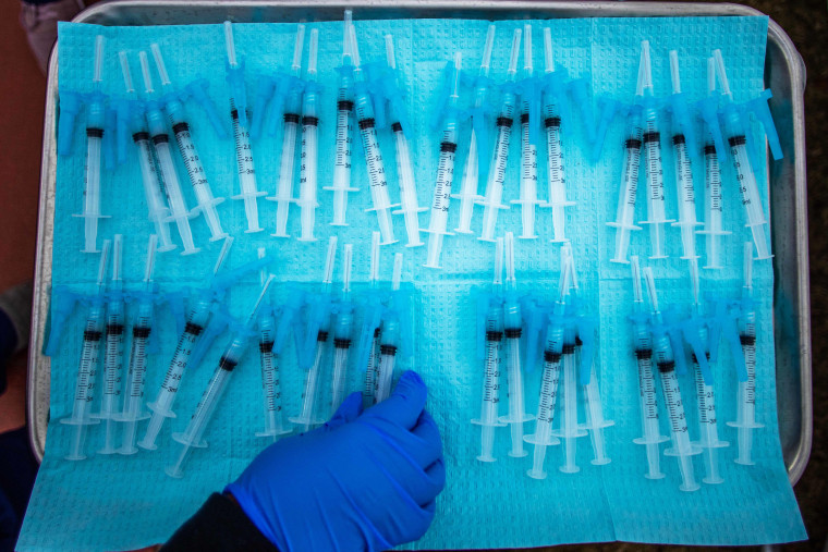 Image: A nurse takes a Moderna Covid-19 vaccines ready to be administered at a vaccination site at Kedren Community Health Center, in South Central Los Angeles on Feb. 16, 2021.