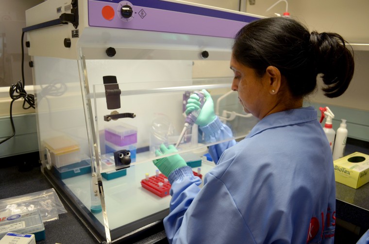Image: A scientist works in the KwaZulu-Natal Research Innovation and Sequencing Platform lab in South Africa, where the new strain of Covid-19 was first discovered.