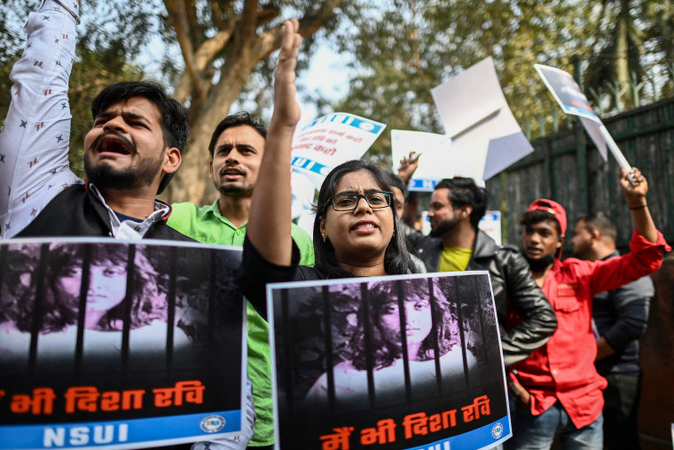 Image: Activists from the National Students' Union of India (NSUI) holding banners and placards shout slogans to protest against the arrest of environment activist Disha Ravi during a demonstration in New Delhi