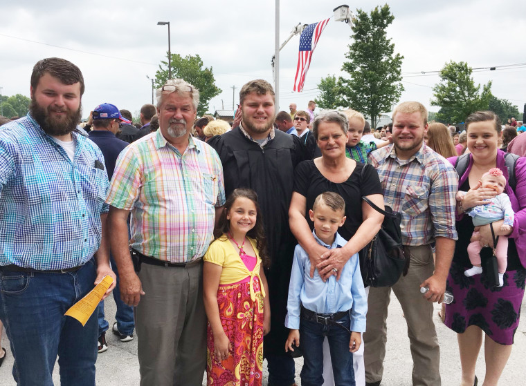 Image:; Kim Johnson and her family at the high school graduation of her son Sam in May 2017