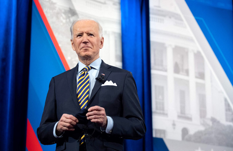 Image: President Joe Biden holds a face mask as he participates in a CNN town hall at the Pabst Theater in Milwaukee on Feb. 16, 2021.