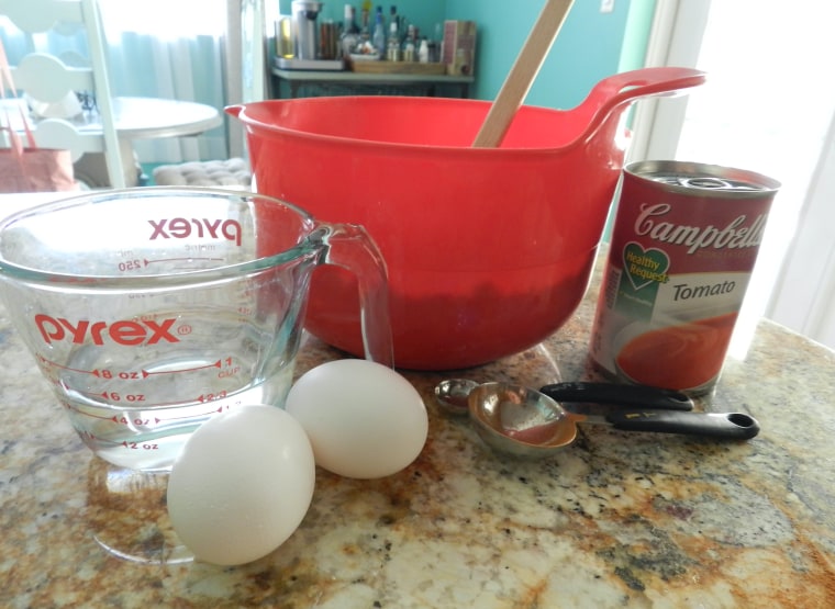 In addition to a box of spice cake mix and a can of Campbell's tomato soup, water and eggs get mixed into the cake batter.