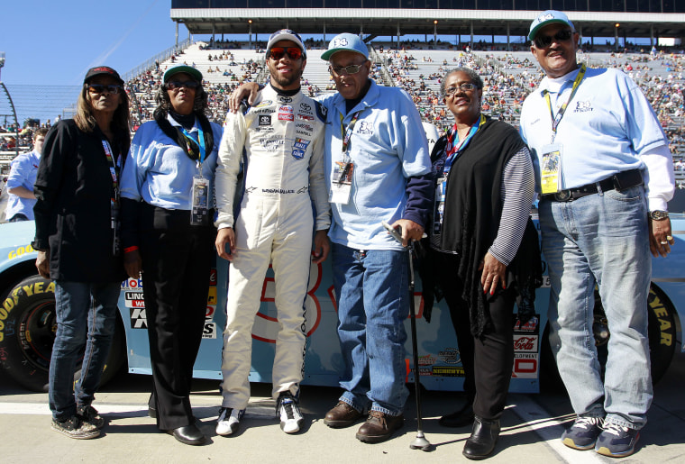 Sybil Scott, Janis Davis, Wendell Scott, Cheryl Ashley and Frank Scott pose with Darrell Wallace, Jr.