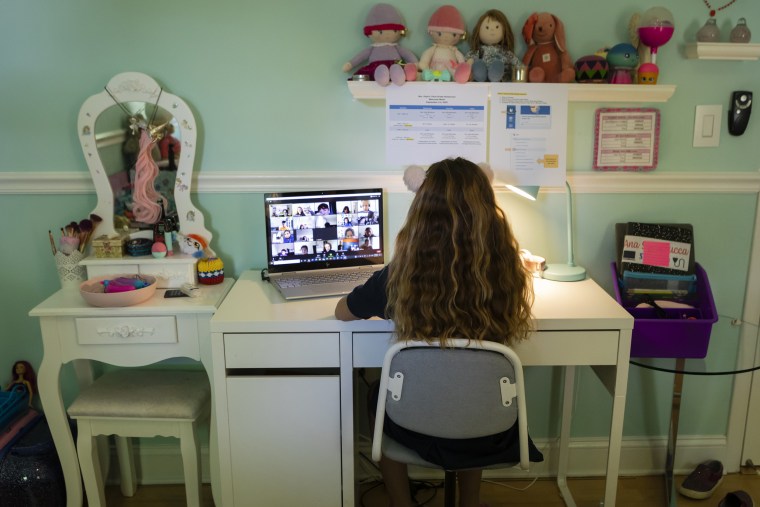 Image: A student attends an online class from home in Miami