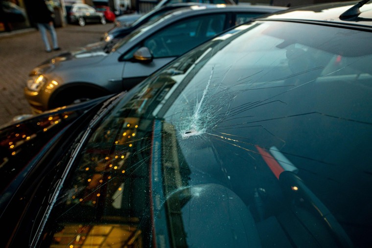 A car damaged after an engine fire on a Boeing cargo plane showered debris on Meerssen, Netherlands, on Feb. 20, 2021.