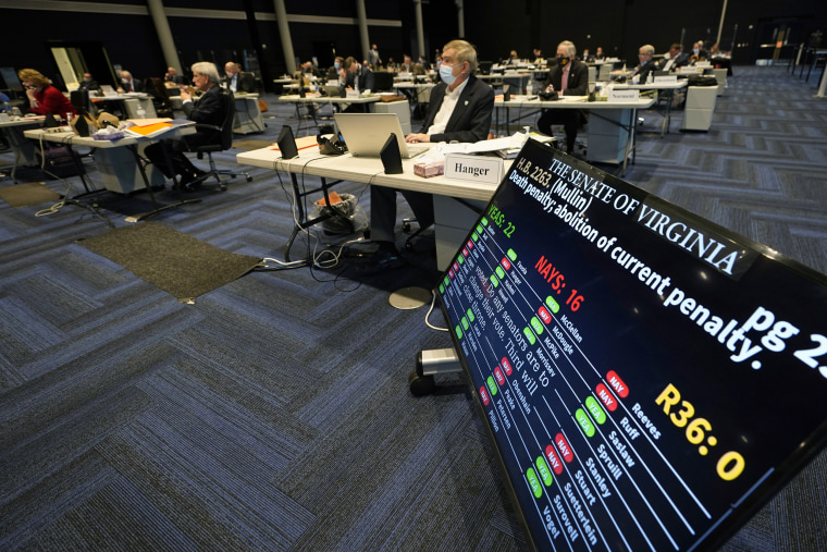 Image: Virginia State Sen. Emmett Hanger, R-Augusta, front, looks at the vote tally board during a vote on a death penalty abolition bill at the Senate session at the Science Museum of Virginia in Richmond, Va., on Feb. 22, 2021.
