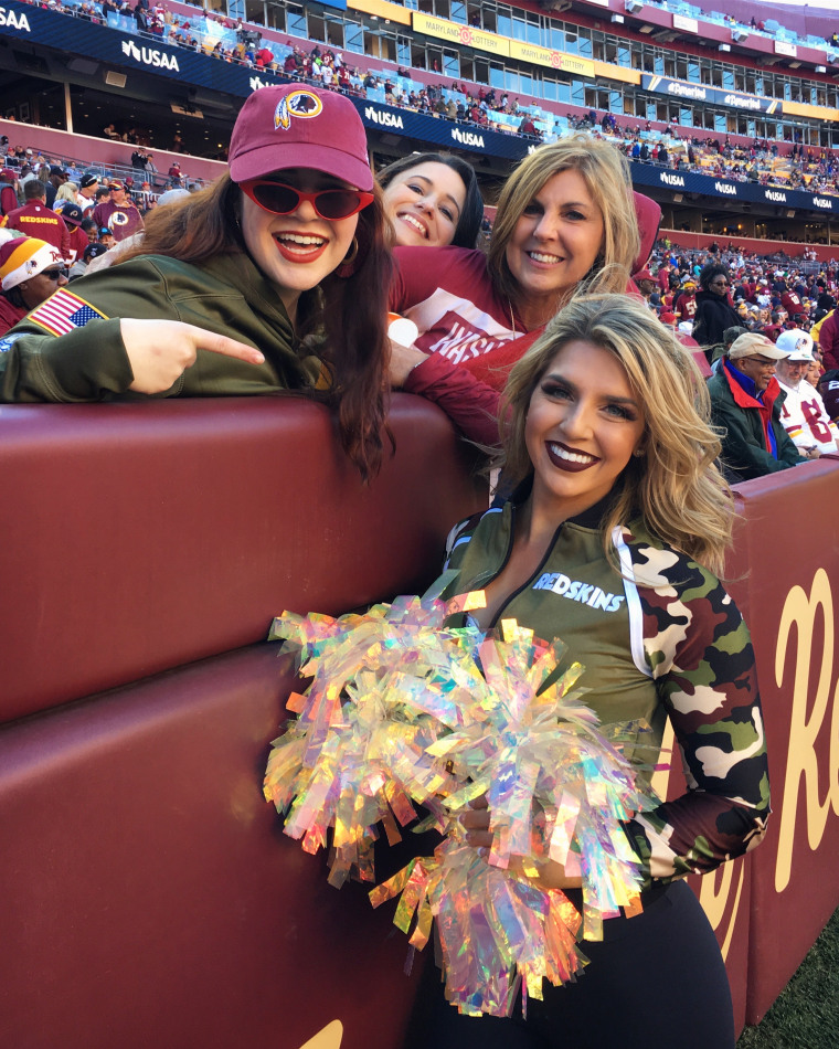 Erica Hanner, formerly a cheerleader for the Washington Football Team, with fans.