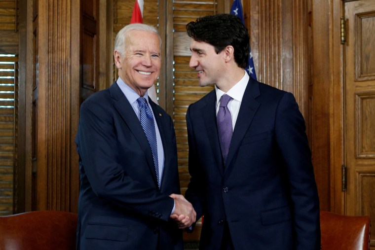Image: Canada's prime minister, Justin Trudeau, shakes hands with then Vice President Joe Biden during a meeting in Trudeau's office on Parliament Hill in Ottawa, Ontario, Canada