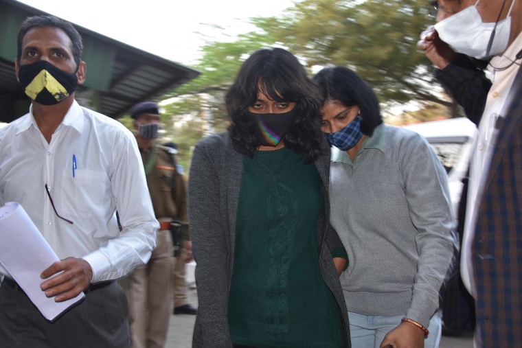 Image: Environment activist Disha Ravi (C) is escorted after being granted bail, outside Tihar jail in New Delhi