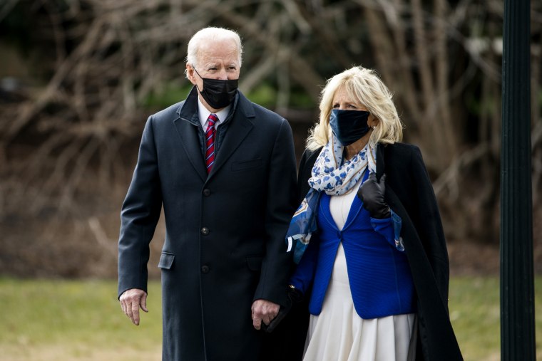 President Joe Biden walks with First Lady Jill Biden on the South Lawn of the White House before boarding Marine One on Jan. 29, 2021.