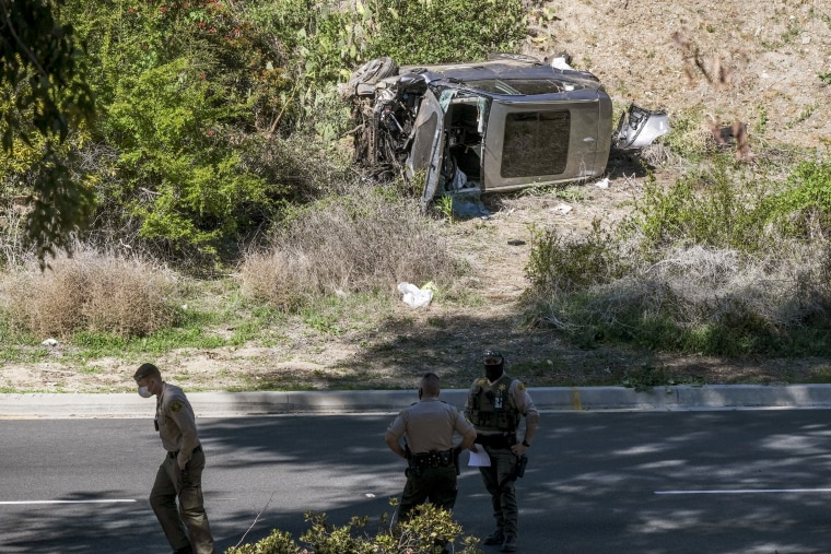 Image: A vehicle rests on its side after a rollover accident involving golfer Tiger Woods along a road in the Rancho Palos Verdes section of Los Angeles on Feb. 23.