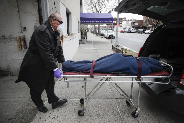 Image: Funeral director collects a body from a nursing home in New York
