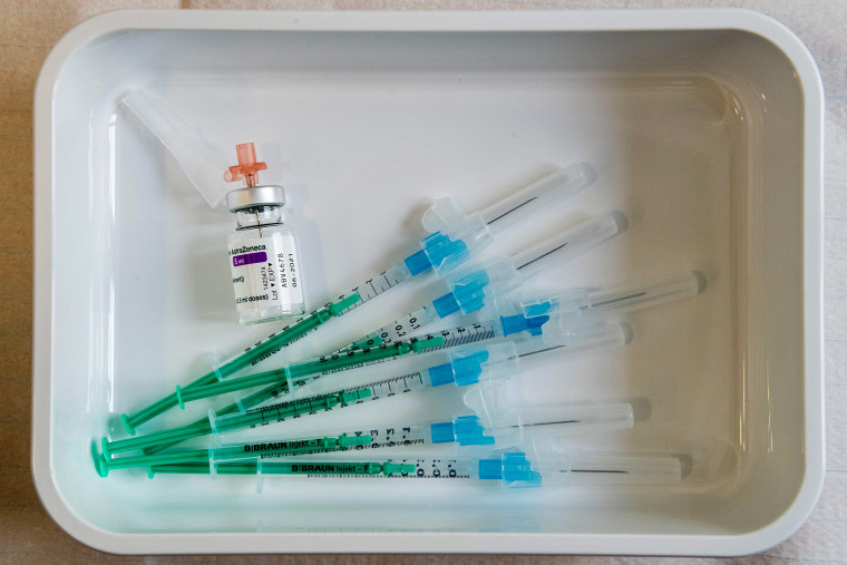 Image: A vial containing the AstraZeneca Covid-19 vaccine is seen next to some syringes on a tray at the university hospital in Halle/Saale, eastern Germany