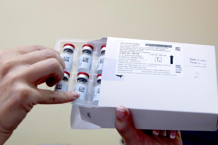 Image: A healthcare worker holds vials containing doses of the Johnson Johnson vaccine against the Covid-19 coronavirus as South Africa proceeds with its inoculation campaign at the Klerksdorp Hospital on Feb. 18, 2021.