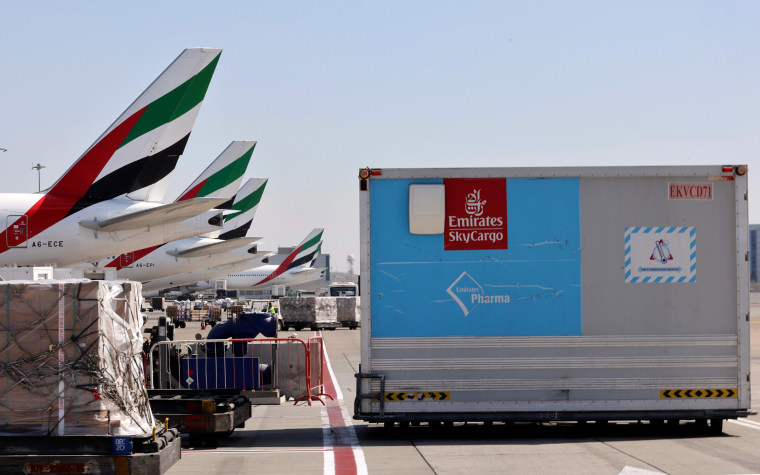 Image: An Emirates Airlines Boing 777 plane carrying a vaccine shipment at Dubai International Airport earlier this month.