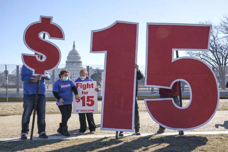 Image: Activists appeal for a $15 minimum wage near the Capitol in Washington