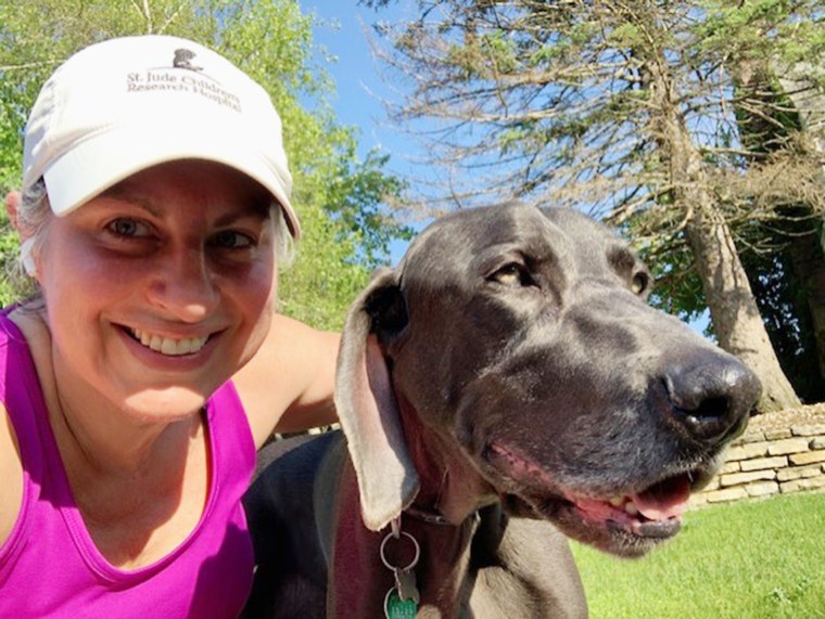 Miller shares a happy moment with her dog Baxter, a "fantastic running buddy," she said. Miller had been training for a marathon when she was diagnosed. 