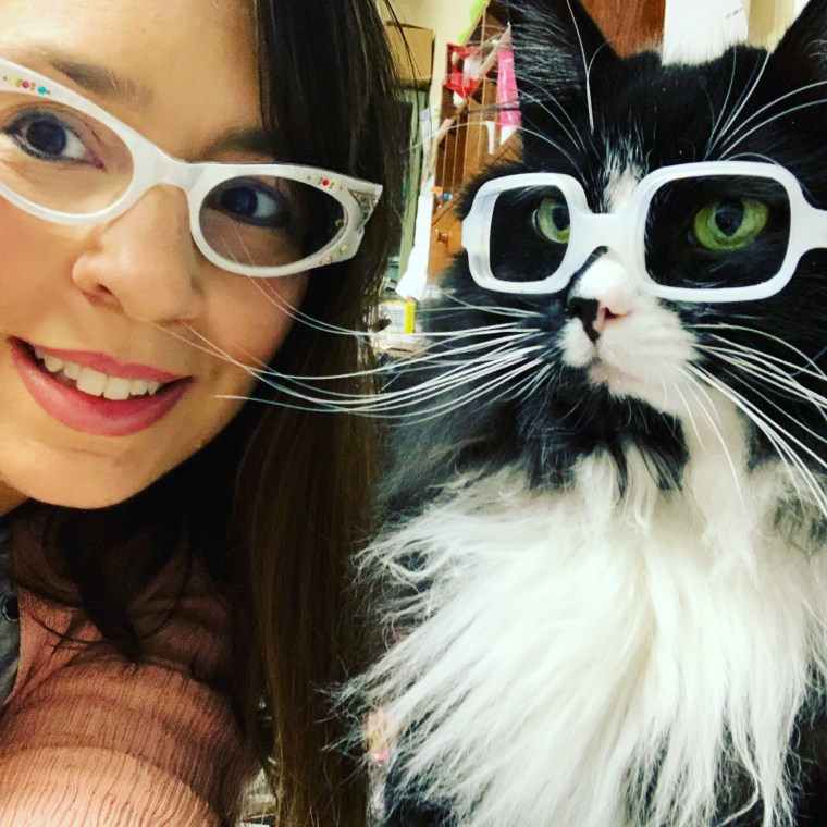 Danielle Crull and Truffles model glasses together.