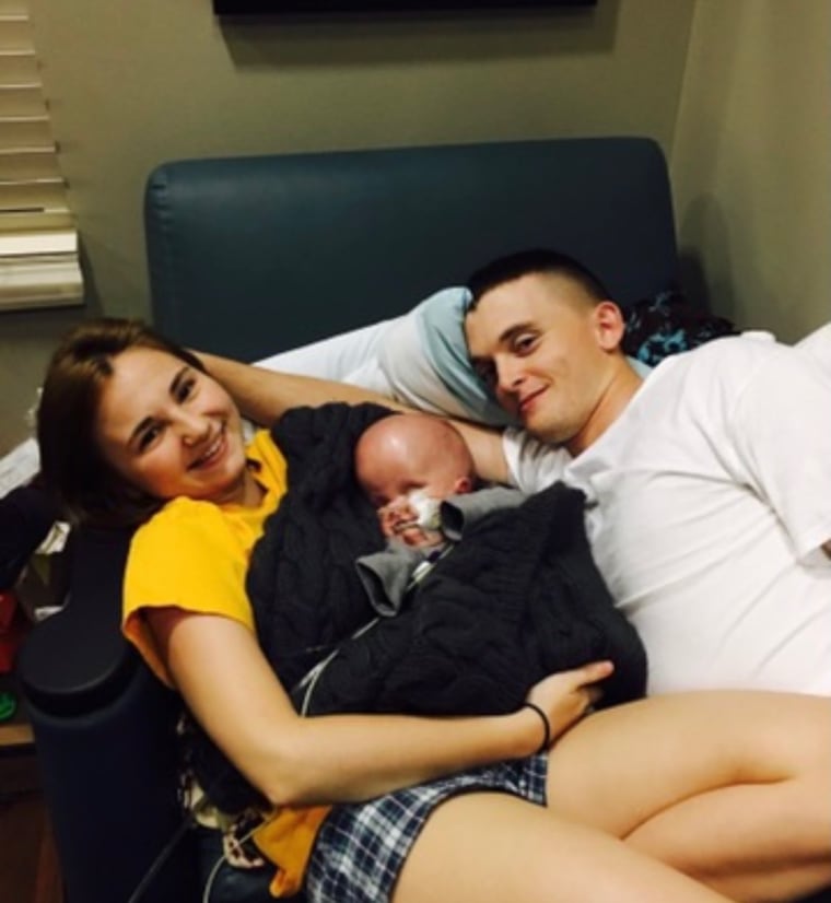 Ben and Kassandra Benton cuddle son, Wyatt Benson.