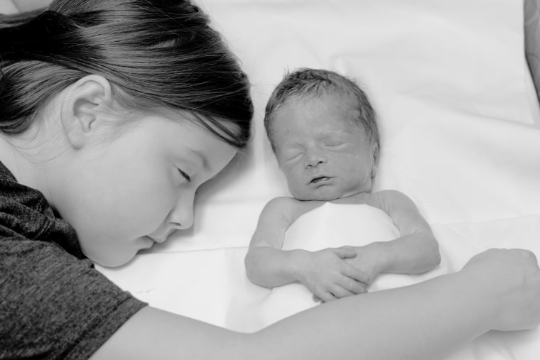 The Umezus' daughter, Maggie, pictured with their oldest daughter, Sophie, died in utero in 2018.