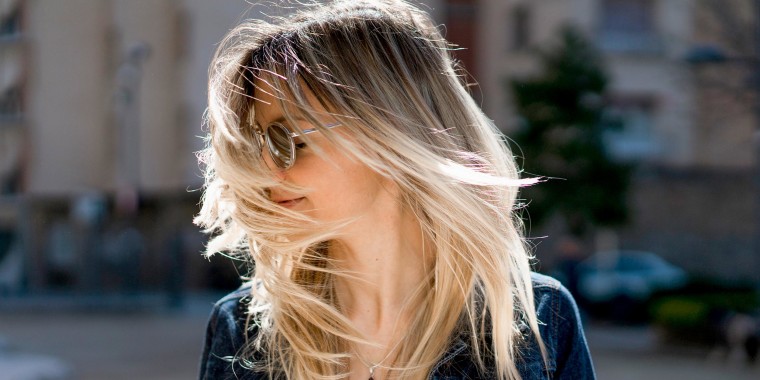 Woman waving her highlighted hair
