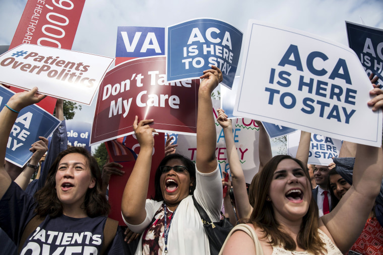 Image:  Supporters of the Affordable Care Act celebrate after the Supreme Court up held the law in the 6-3 vote at the Supreme Court in Washington