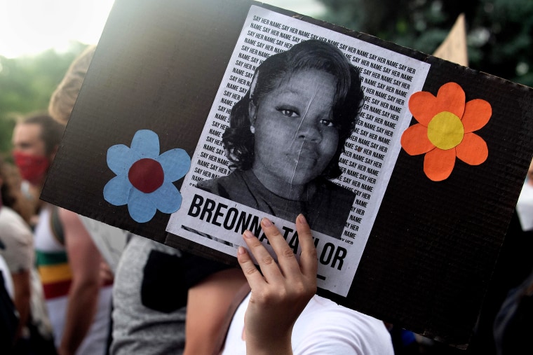 A demonstrator holds a sign with the image of Breonna Taylor in Denver on June 3, 2020.