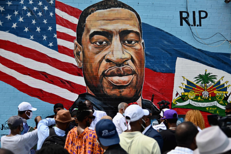 Image: The unveiling of artist Kenny Altidor's memorial portrait of George Floyd on the wall of a CTown Supermarket on July 13, 2020 in Brooklyn, New York.