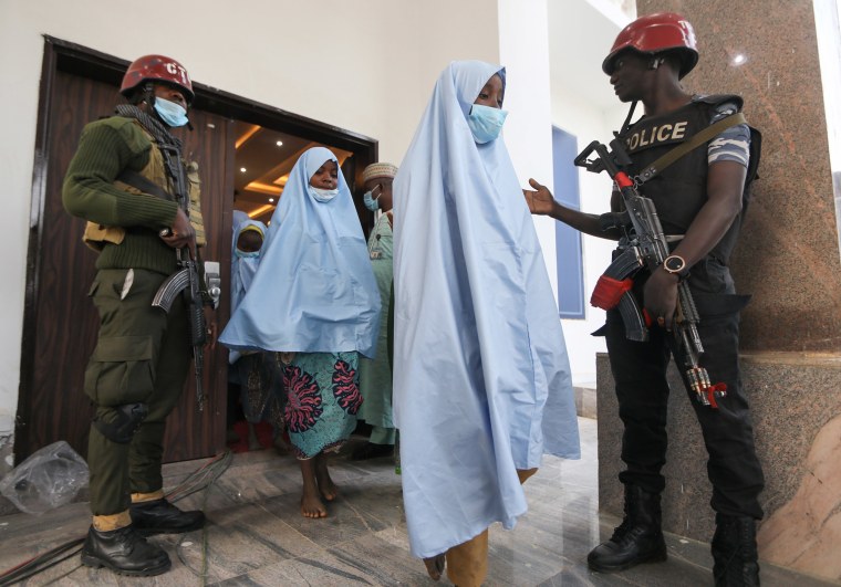 Image: Girls who were kidnapped from a boarding school in the northwest Nigerian state of Zamfara, head for a medical check-up after their release in Zamfara, Nigeria