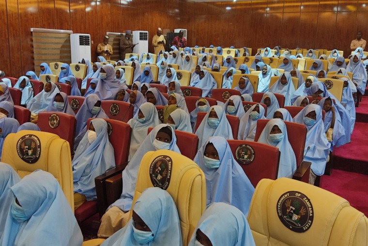 Image: A group of girls previously kidnapped from their boarding school in northern Nigeria arrive  at the Government House in Gusau, Zamfara State upon their release.