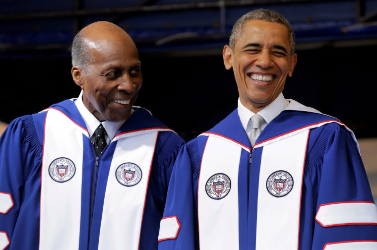 President Barack Obama smiles as he speaks with Vernon Jordan before delivering the commencement address to the graduating class of Howard University in Washington on May 7, 2016.