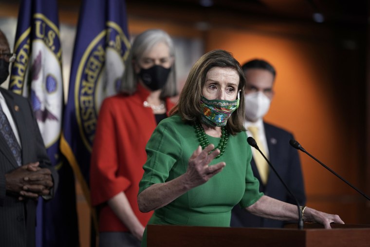 Image: Speaker of the House Nancy Pelosi, D-Calif., meets with reporters before the House votes to pass a $1.9 trillion pandemic relief package, during a news conference at the Capitol in Washington