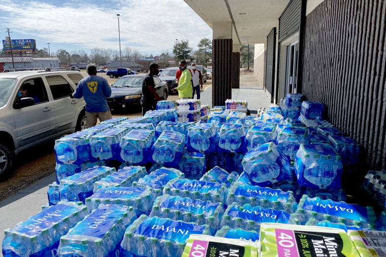 Staff members and volunteers with the MS Black Women's Roundtable recently joined with other community partners in providing critical resources like water, hot meals and other necessities at Wingfield High School as part of an ongoing relief effort underw