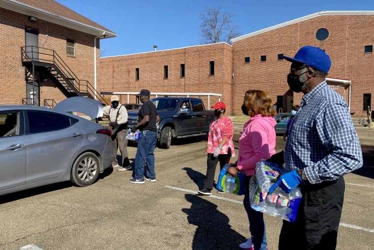 Staff members and volunteers with the MS Black Women's Roundtable recently joined with other community partners in providing critical resources like water, hot meals and other necessities at Cade Chapel M.B. Church as part of an ongoing relief effort unde