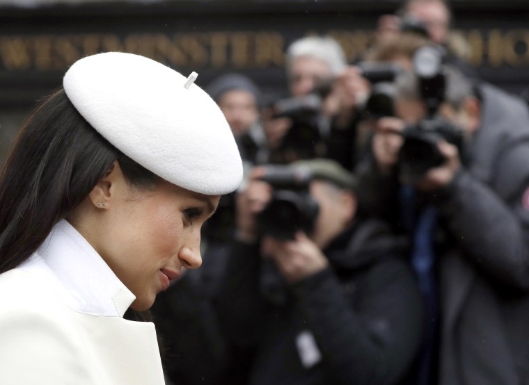 Image: Photographers focus on Meghan Markle, fiancee of Britain's Prince Harry as she leaves a Commonwealth Day Service at Westminster Abbey in central London