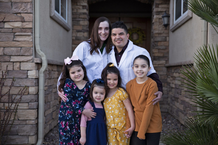 Image: Marilyn and Shane Jerominski with their children, from left, Shaela, 7, Shia, 3, Shiloh, 5, and Shalyn, 9, at their home in Indio, Calif., on Feb. 19, 2021.