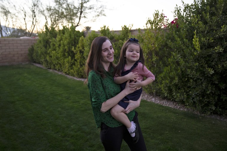 Image: Marilyn Jerominski holds Shia, 3, at their home in Indio, Calif., on Feb. 19, 2021.