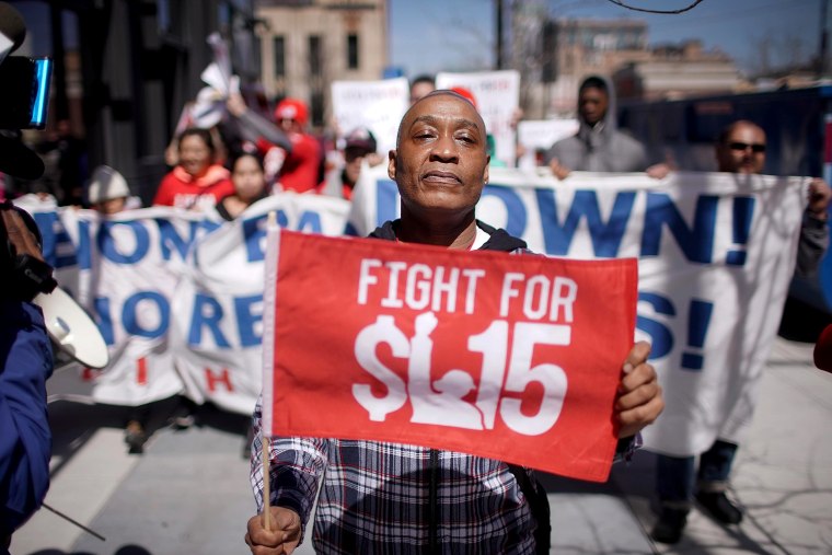 Demonstrators march in front of the McDonalds Headquarters demanding a minimum wage of $15-per-hour and union representation on April 3, 2019 in Chicago.