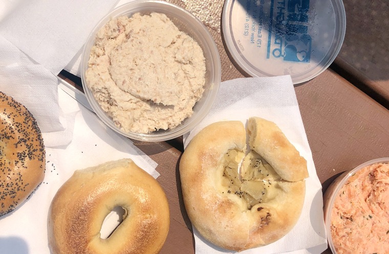 Takeout from the Upper East Side Russ and Daughters Café on a picnic table in Central Park: bagels, bialy, whitefish salad and their incomparable Hot Smoke/Cold Smoke salmon.