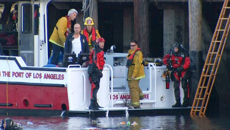Rescuers with the Los Angeles Fire Department pulled two boys from a submerged vehicle on April 9, 2015.